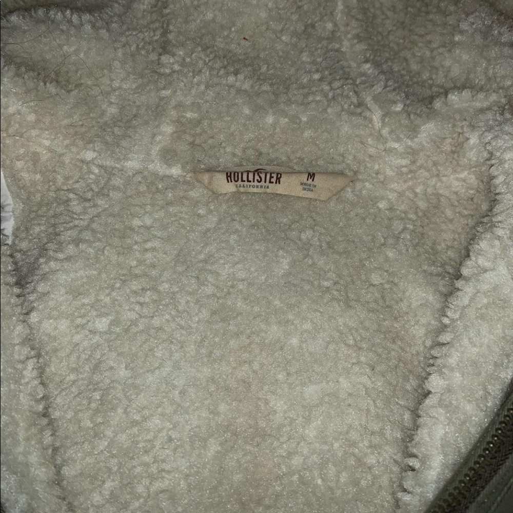 Long Hollister coat with fur on the inside.